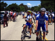 The usual zoo of riders in the parking area past the finish line.jpg
