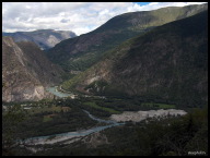 The main road through the valley cuts through the mountains along the river.jpg