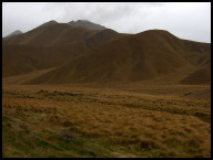 Grassland hills on the other side of the range.jpg