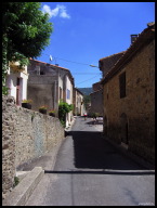 IMG_1588 Local cyclists riding down main street in Maisons.jpg