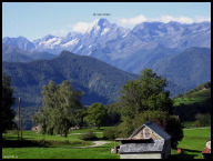 Follow the one-laner through Cominac to three cyclists admiring the French-Spanish Pyrenees.jpg