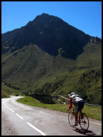 An unknown rider descending towards a jagged peak.jpg