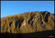 The sun setting on a peak near the top of Luz-Ardiden.jpg