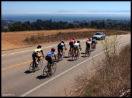 Cat 4-5 - The lead group speeding past a view of Monterey Bay.jpg