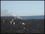 It's a four mile hike over lava to get a good view of the fresh lava flowing into the ocean.jpg